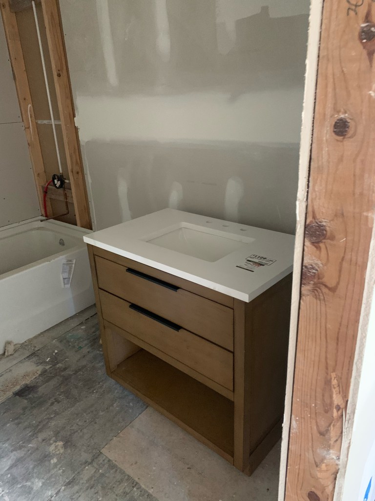Custom since with cabinet being installed in bathroom